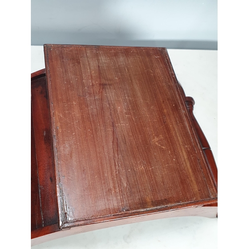 495 - An early 19th Century mahogany Cheese Coaster with roundels to the ends of the half-turned handles, ... 