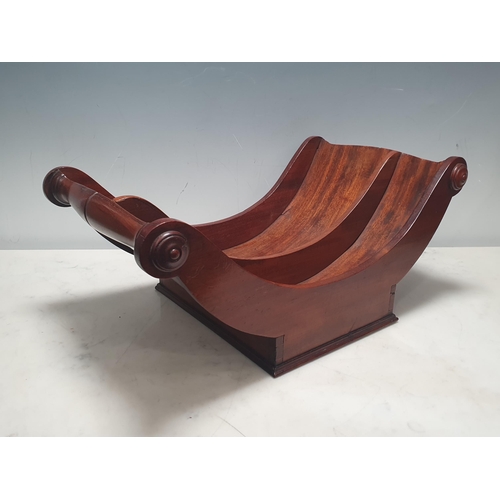 495 - An early 19th Century mahogany Cheese Coaster with roundels to the ends of the half-turned handles, ... 