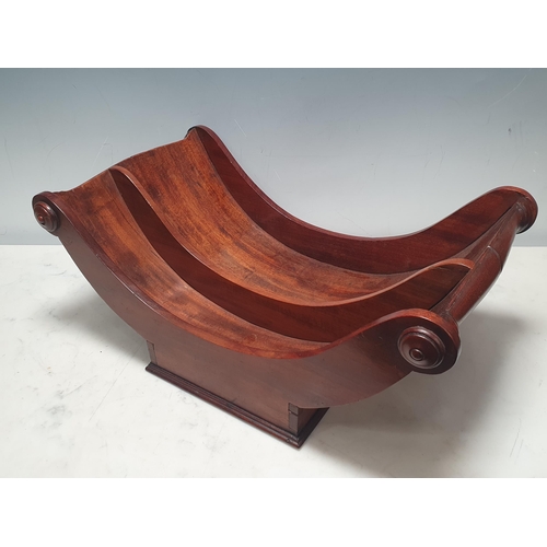 495 - An early 19th Century mahogany Cheese Coaster with roundels to the ends of the half-turned handles, ... 