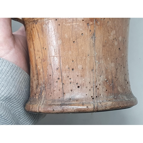 503 - An Irish treen 18th Century Lamhog of cylindrical tapering form, with incised ring decorations, carv... 