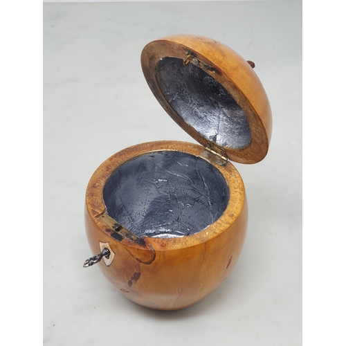 507 - Two turned treen Tea Caddies, one in the form of a pear, 7in H and another in the form an apple, 5in... 