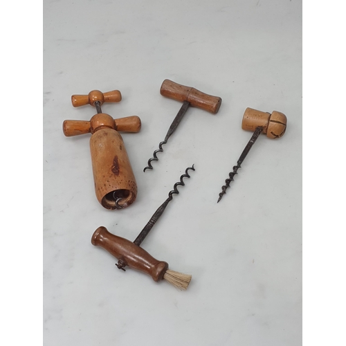 513 - A collection of treen and related items including four Corkscrews, a vintage Football Rattle bearing... 