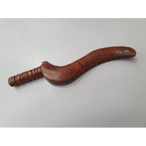 517 - A collection of treen items including a 19th Century turned lead weighted Fishing Priest, a goose wi... 