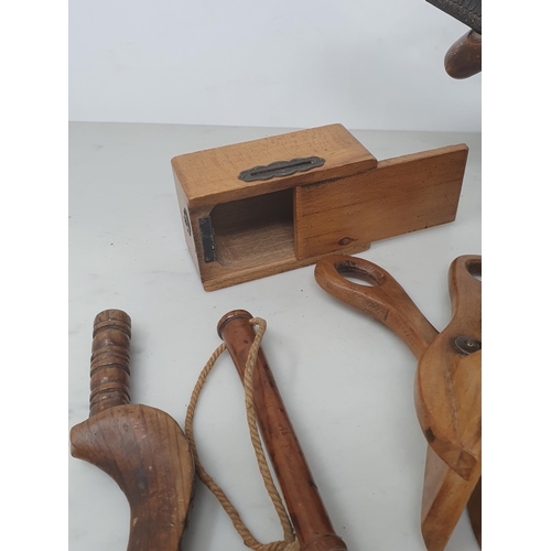 517 - A collection of treen items including a 19th Century turned lead weighted Fishing Priest, a goose wi... 