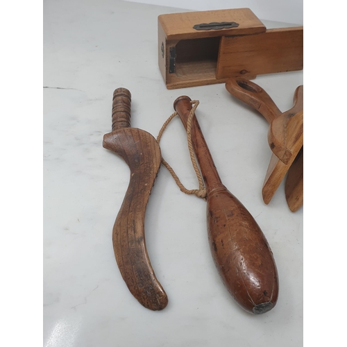 517 - A collection of treen items including a 19th Century turned lead weighted Fishing Priest, a goose wi... 