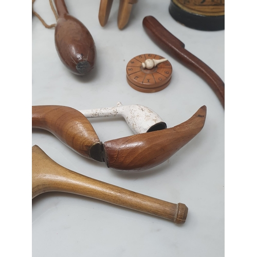 517 - A collection of treen items including a 19th Century turned lead weighted Fishing Priest, a goose wi... 