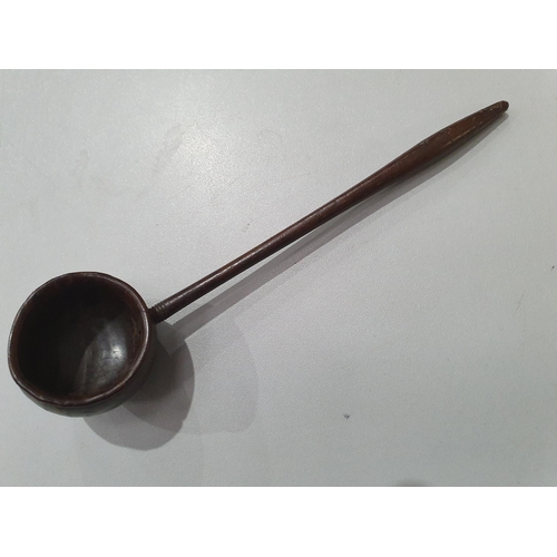 529 - A collection of treen Spoons including two Toddy Ladles, two Ladles, a carved and dated Love Spoon, ... 