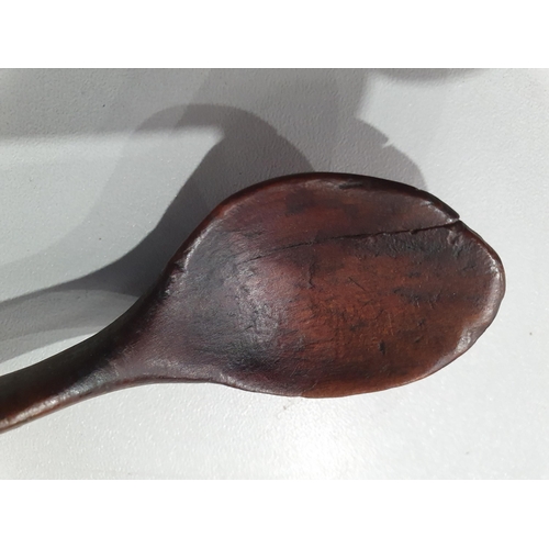 529 - A collection of treen Spoons including two Toddy Ladles, two Ladles, a carved and dated Love Spoon, ... 