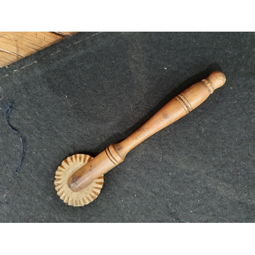 530 - A collection of treen items including a Butter Roller, four Butter Curlers, a Dairy Strainer and two... 