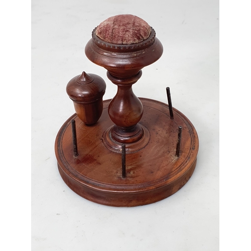 533 - A treen 'Clark and Co's Anchor Sewing Cottons' Thread Dispenser, a treen 'The M.E.Q.' six Cord Dispe... 