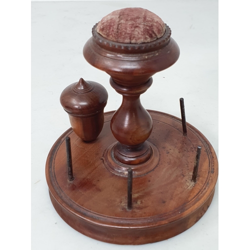 533 - A treen 'Clark and Co's Anchor Sewing Cottons' Thread Dispenser, a treen 'The M.E.Q.' six Cord Dispe... 