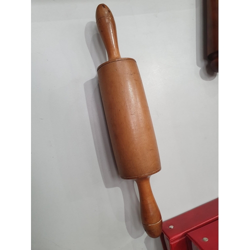 534 - A collection of treen including a single ended Rolling Pin, another Rolling Pin, a treen oat crushin... 