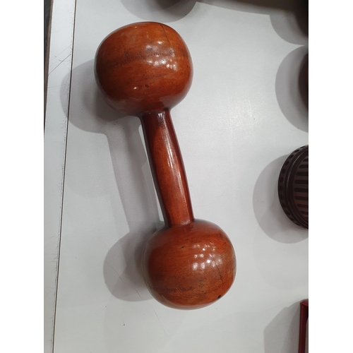 542 - A collection of treen including a pair of turned lignum vitae Dumbbells, a circular treen lidded Box... 