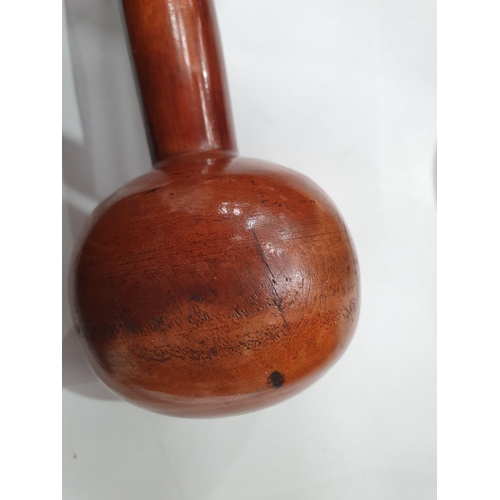 542 - A collection of treen including a pair of turned lignum vitae Dumbbells, a circular treen lidded Box... 