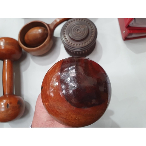 542 - A collection of treen including a pair of turned lignum vitae Dumbbells, a circular treen lidded Box... 