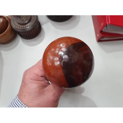 542 - A collection of treen including a pair of turned lignum vitae Dumbbells, a circular treen lidded Box... 