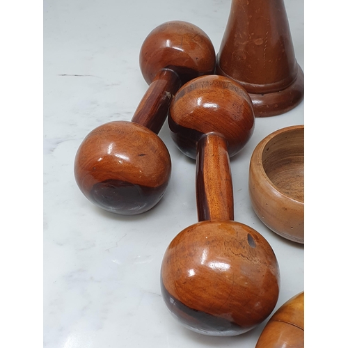 542 - A collection of treen including a pair of turned lignum vitae Dumbbells, a circular treen lidded Box... 