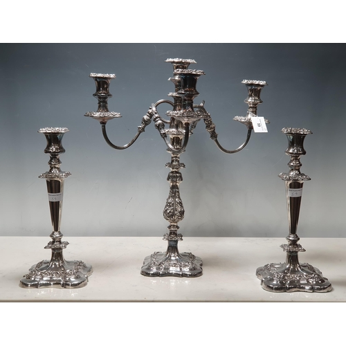 59 - A plated Candelabra with floral decorated bulbous column on shaped square base, the surmount with fo... 