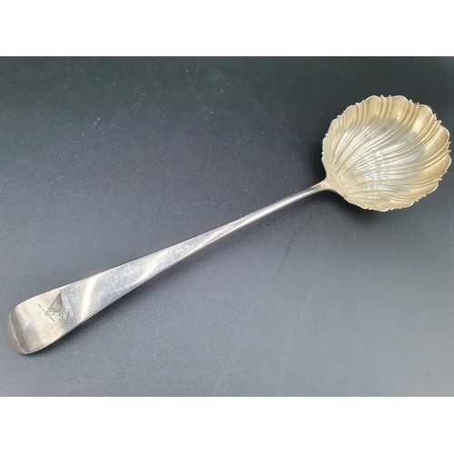 66 - A George III silver Ladle old English pattern with scallop Bowl, engraved crest, circa 1770, maker: ... 