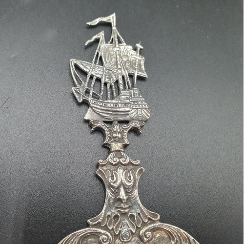 70 - A Dutch silver Spoon, the oval bowl decorated three figures including fiddler, sailing ship finial, ... 