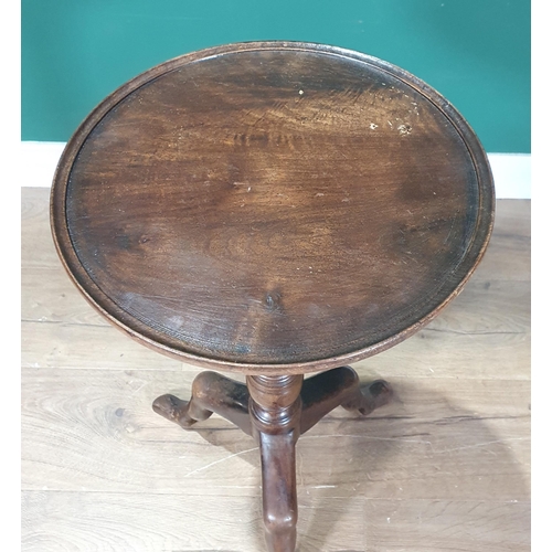 742 - A 19th Century mahogany Manx tripod Table with dish top and turned stem, 14in D