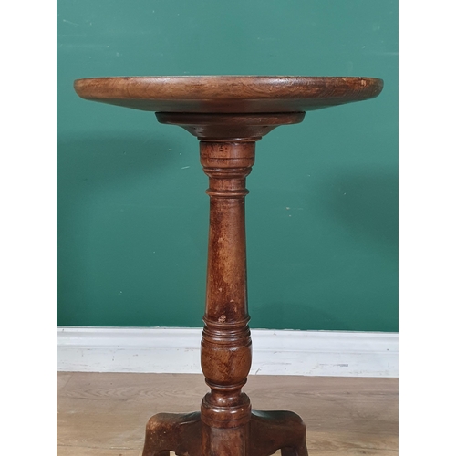 742 - A 19th Century mahogany Manx tripod Table with dish top and turned stem, 14in D