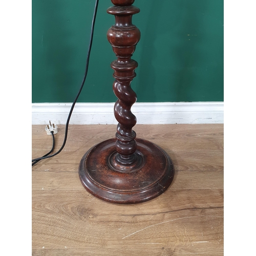 744 - An antique turned mahogany Pricket Type standing Candlestick with barley twist turning, on a turned ... 