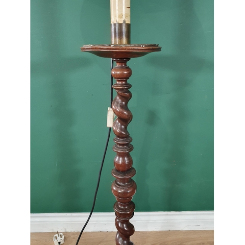 744 - An antique turned mahogany Pricket Type standing Candlestick with barley twist turning, on a turned ... 