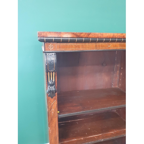 749 - An aesthetic walnut open Bookcase with incised and gilded frieze above three sections of adjustable ... 