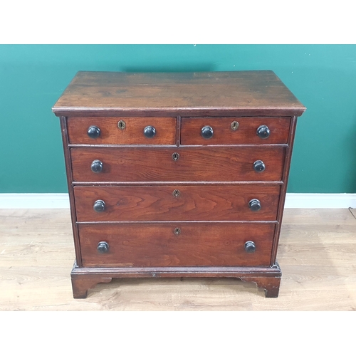 751 - An early 19th Century Welsh oak Chest of two short and three long drawers with turned wood handles a... 