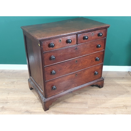 751 - An early 19th Century Welsh oak Chest of two short and three long drawers with turned wood handles a... 