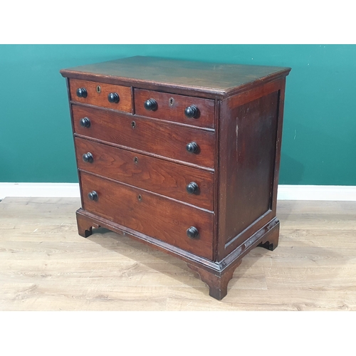 751 - An early 19th Century Welsh oak Chest of two short and three long drawers with turned wood handles a... 