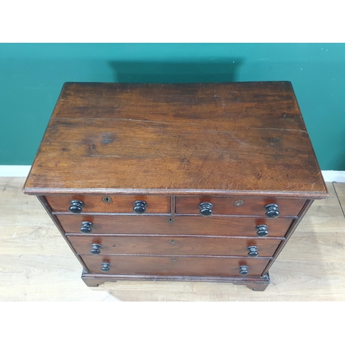 751 - An early 19th Century Welsh oak Chest of two short and three long drawers with turned wood handles a... 