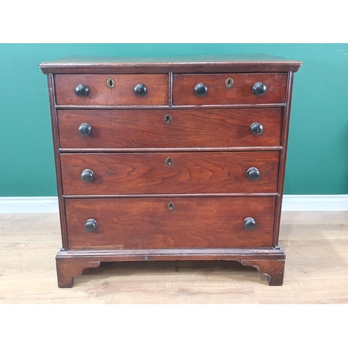 751 - An early 19th Century Welsh oak Chest of two short and three long drawers with turned wood handles a... 