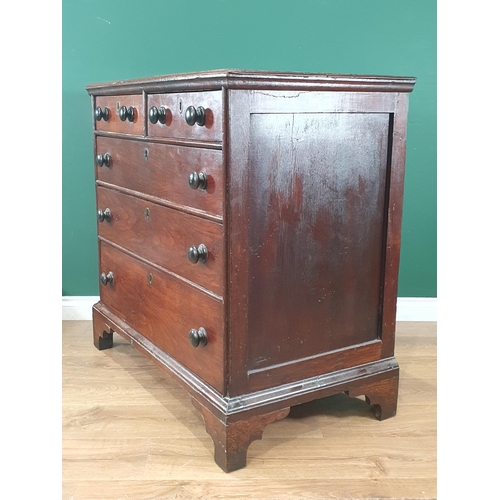 751 - An early 19th Century Welsh oak Chest of two short and three long drawers with turned wood handles a... 