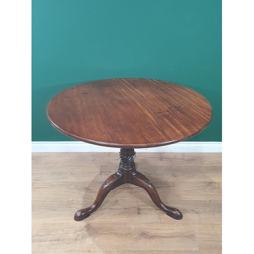 763 - A George II mahogany Supper Table with circular top on turned and fluted column, the tripod base wit... 