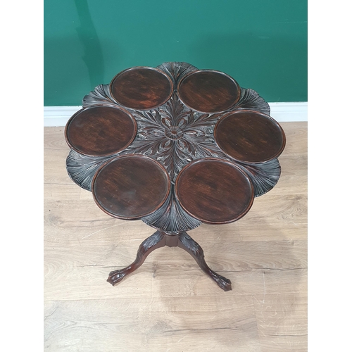 764 - A Georgian mahogany Table, the shaped top with six dished sections, carved leafage and rosette desig... 