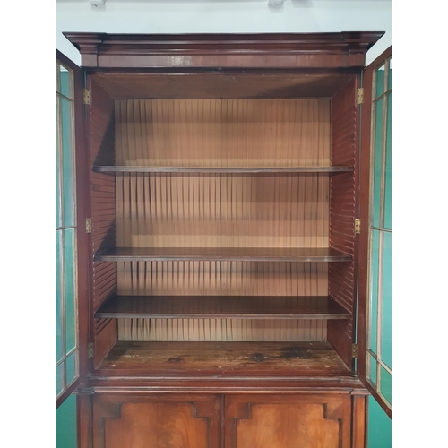 765 - A 19th Century mahogany Glazed Bookcase, the moulded cornice, above pair of glazed doors enclosing t... 