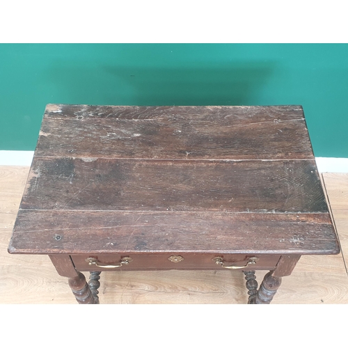 768 - A late 17th Century oak Side Table with three plank top above single frieze drawer with later handle... 