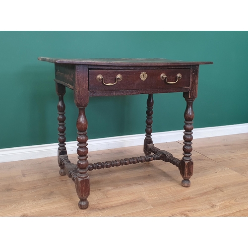 768 - A late 17th Century oak Side Table with three plank top above single frieze drawer with later handle... 