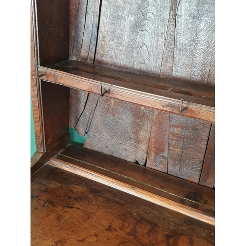 769 - An 18th Century oak Cardiganshire Dresser and Rack, the rack with two shelves having blacksmith forg... 