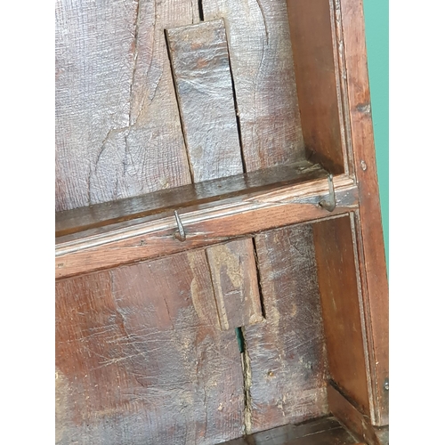 769 - An 18th Century oak Cardiganshire Dresser and Rack, the rack with two shelves having blacksmith forg... 