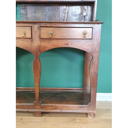 769 - An 18th Century oak Cardiganshire Dresser and Rack, the rack with two shelves having blacksmith forg... 