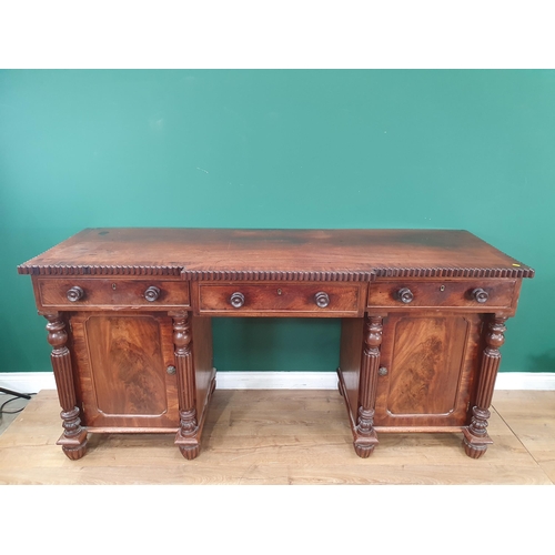 773 - A William IV mahogany Breakfront Pedestal Sideboard, fitted three drawers above two cupboards flanke... 