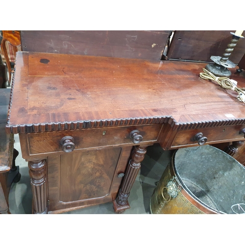 773 - A William IV mahogany Breakfront Pedestal Sideboard, fitted three drawers above two cupboards flanke... 