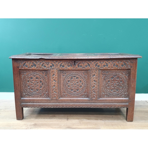 776 - A 17th Century oak West Country Coffer with sunken three panel lid above arcaded leafage shallow car... 