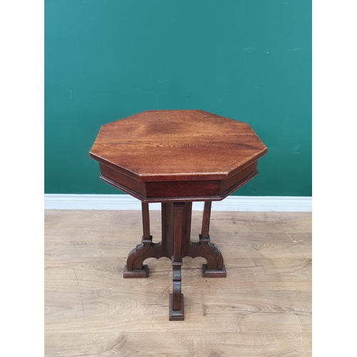 781 - A Victorian oak Gothic design octagonal Occasional Table on cluster supports and arched feet, with i... 