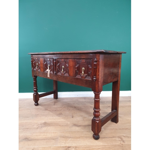 783 - A moulded oak Dresser Base in the 17th Century style, with pair of fitted drawers, on turned support... 