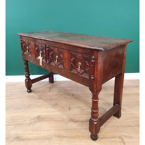 783 - A moulded oak Dresser Base in the 17th Century style, with pair of fitted drawers, on turned support... 