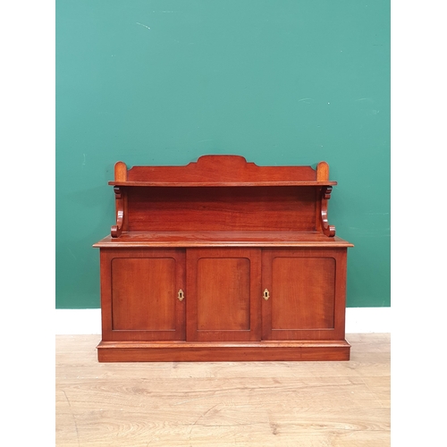 784 - A mahogany table-top Chiffonier, the raised back with scrolled supports above a pair of cupboard doo... 